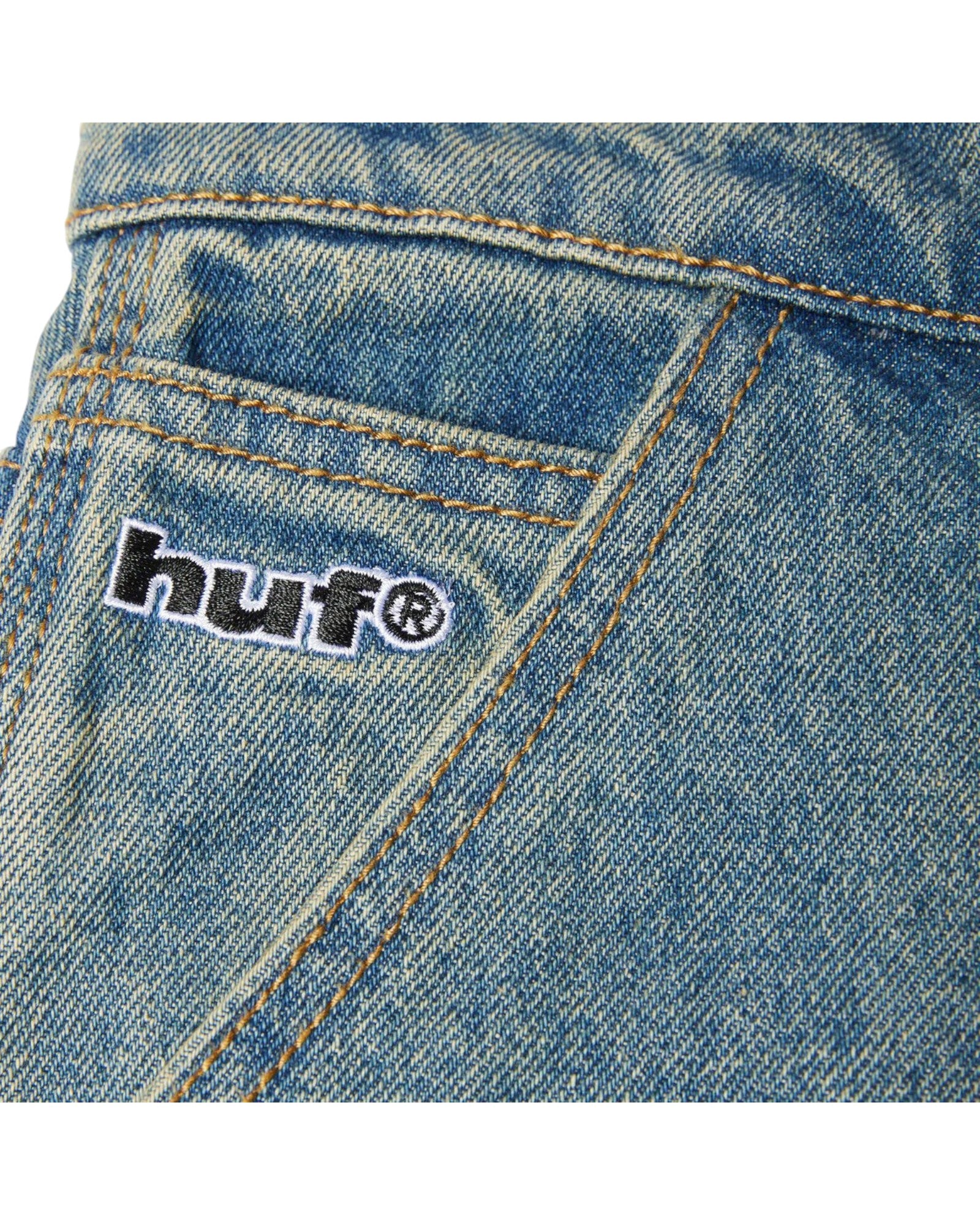 HUF Kinda Loose Double Knees jeans in dirty wash blue denim with embroidered logo.