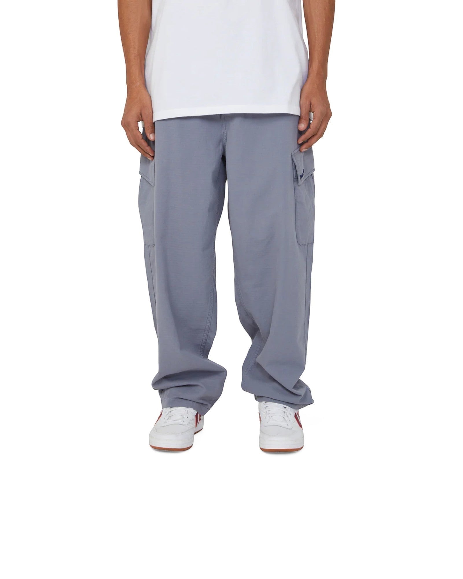 impostor.ro HUF Pretty Baggy Cargos in blue, featuring multiple pockets and a relaxed fit.