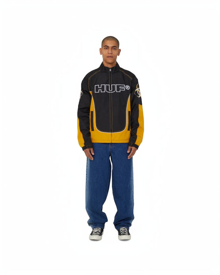 impostor.ro HUF Sector Jacket in black and yellow with white HUF logo and biohazard graphic on sleeve.
