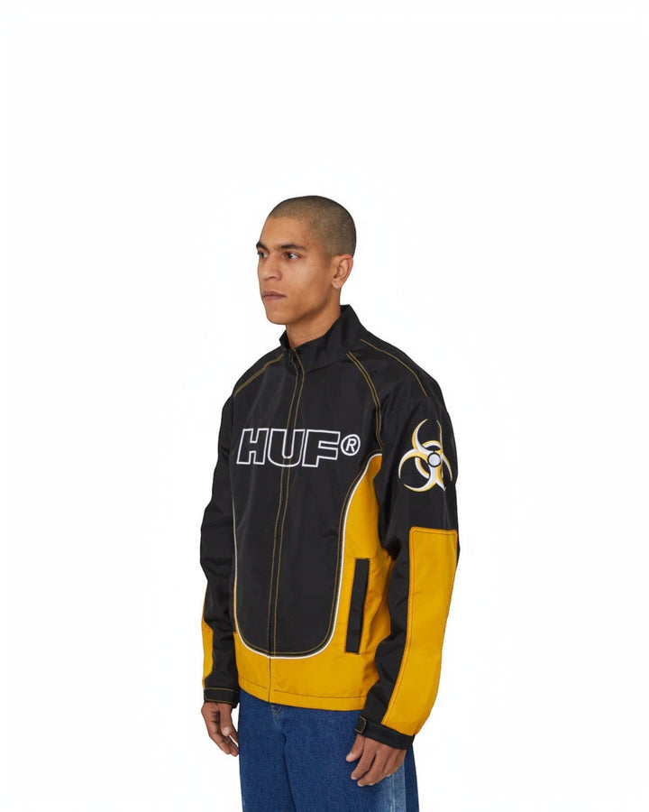 impostor.ro HUF Sector Jacket in black and yellow with large HUF logo on chest and biohazard symbol on sleeve.